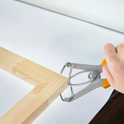 The Ultimate 8 Piece Spring Clamp Miter Tool Kit For Woodworking Pros That Lets You Grip Frames And Trim With Ease While Doing Precise Joint Work On Your Next Cabinetry Project Without Breaking A Sweat. stainless steel spring clamp holding wood miter joint