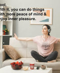 Person relaxing on sofa with headphones in a cozy living room, surrounded by snacks and decor, feeling peaceful.