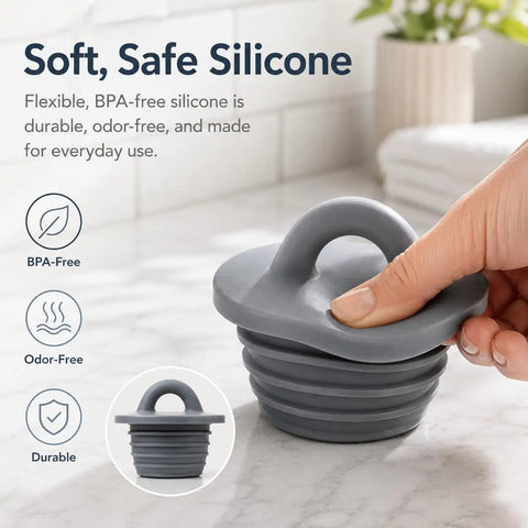 Universal Silicone Drain Plug Set For Bathtub And Bathroom Sink Features A Smooth Ring Grip Handle, showing gray silicone plug with handle.