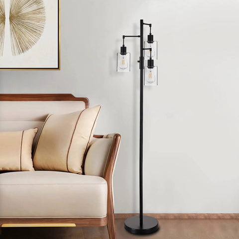 Three Light Industrial Floor Lamp With Glass Shades For Living Room Dope Vibe next to beige sofa