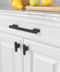 Installed matte black cabinet pulls set 10 pack 5 inch 128mm center to center kitchen cabinet handles hardware on white cabinetry.