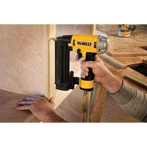 Professional 18 Gauge Brad Nailer With Rear Exhaust Blasts Dust Away Tight Trigger Knocks Out Trim And Cabinet Work Smooth As Silk in use, fastening wood.