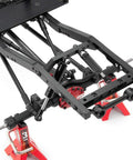 Close-up of 4 Pack 120mm RC Shock Absorbers With Internal Springs For 1/10 Scale Crawlers on model frame, highlighting installation.