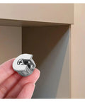 Close-up of Cam Lock Pins Kit 10 Pcs Furniture Connecting Brackets for Cabinets and Wardrobes in hand.