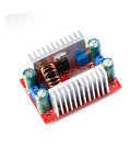 Kickass Four Pack Of 400 Watt Step Up Boost Converter Modules With Wide Adjustable Output Range And Heavy Duty 15 Amp Constant Current Regulation For Automotive And Tech Projects, featuring aluminum heat sink and capacitors.