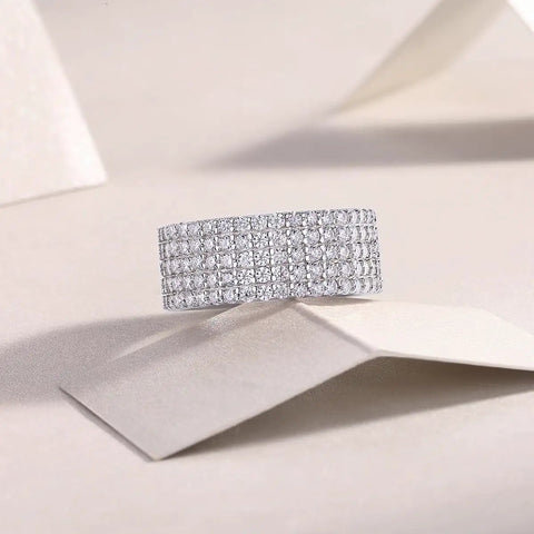 Fresh Drip Platinum Plated Moissanite Grid Engagement Ring Featuring A Smooth Wide Band And Lab Grown Diamond Sparkle Set In Solid Certified 925 Sterling Silver Ring For Her on a soft background.