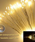 Lit 4 Pack Firework LED Copper Wire Star String Lights with Remote, 8 modes, shining warm white against dark background.