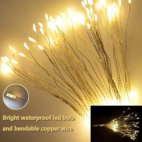 Lit 4 Pack Firework LED Copper Wire Star String Lights with Remote, 8 modes, shining warm white against dark background.