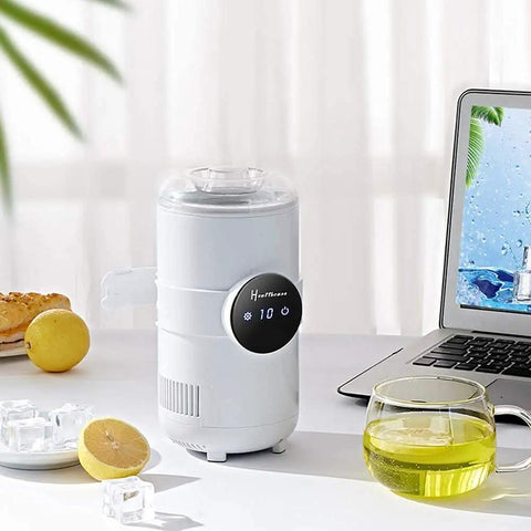 Sharp Two In One Electric Cooling Cup And Slim Desktop Beverage Chiller beside a laptop, cooling drinks with a sleek design.