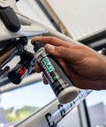 Hand applying Silky Suspension Serum 100ml Protective Spray For Bike Shocks And Seals Reduces Stiction And Friction Repels Dirt