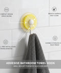 Rock Solid Adhesive Wall Hooks 1 Pack Killer Hold Zero Damage No Drill Installation For Bath Towels Robes Kitchen Utensils Ceramic Tile Glass Mirrors Painted Drywall Cabinets Hang Items With Ease, showing a yellow adhesive towel hook on a smooth surface.