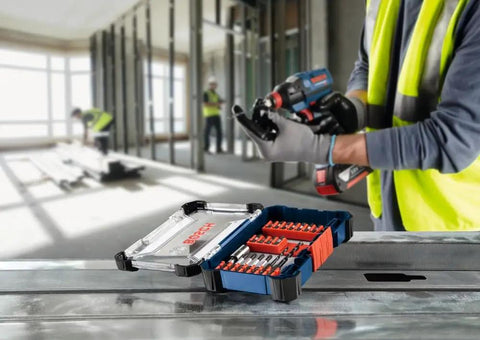 24 Piece Impact Tough Screwdriving Set With Tilt In Case And Custom Storage Long Lasting Bits For High Torque 10x Life Advantage Over Standard Bits Easy Access Built For Tough Jobs on construction site table