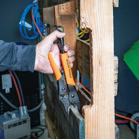 Locking Pliers Set With 7 Inch And 10 Inch Curved Jaw Pliers Quick Release Handles Pinch Free Design gripping a wooden pallet