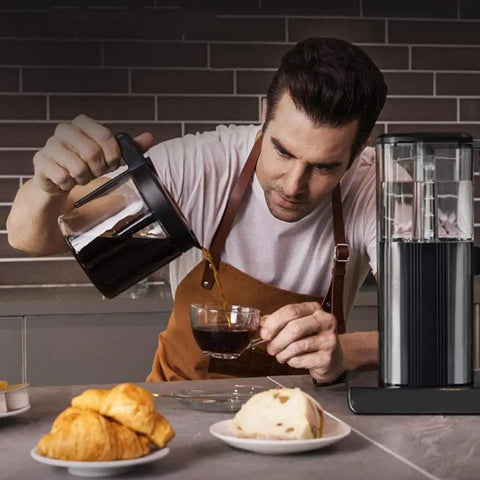 Heavy Duty Fully Automatic Espresso And Drip Coffee Maker With Digital Display Six Steam Nozzles For Killer Brews pouring coffee into a cup.