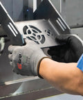 Person wearing G Grip Micro Foam Nitrile Palm Coated Seamless Gloves With 15 Gauge Nylon Shell For Auto, Manufacturing And General Purpose Work, Lightweight, Comfy Fit, Great Grip In Gray And Black, X Large Pack Of 12, handling metal part.