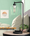 Table lamp with clear glass shade in wine cup shape, showcasing the Two Pack Clear Glass Lamp Shade In Wine Cup Shape For Pendant Lights Chandeliers And Vanity Fixtures, 5.51 Inches High, 4.72 Inches Diameter, 1.96 Inch Fitter, Ultra Clear Transmittance, Replacement Glass Covers.