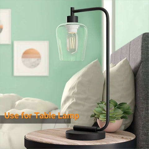 Table lamp with clear glass shade in wine cup shape, showcasing the Two Pack Clear Glass Lamp Shade In Wine Cup Shape For Pendant Lights Chandeliers And Vanity Fixtures, 5.51 Inches High, 4.72 Inches Diameter, 1.96 Inch Fitter, Ultra Clear Transmittance, Replacement Glass Covers.