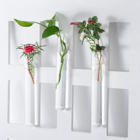 Three glass test tubes from the Glass Test Tube Set, 24 Pieces, 80ml Each, with plants, on a white background.