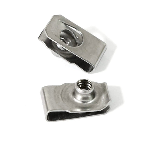 Close-up view of stainless steel U-nuts for auto body panel mounting, part of the Forty Pack Quarter Inch By Twenty Thread Stainless Steel U Nuts Clip On Panel Mounting Hardware Built Solid Gear Real Deal Lock Washer And Nut Combo For Auto Body Shop And Daily Driver Repairs.