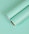 Thick Pastel Mint Metallic Peel And Stick Wallpaper With Brushed Matte Surface gives your space a straight up glow up rolled up for easy application.