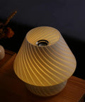 Swirl Mushroom Lamp With Vintage Striped Murano Glass, Soft Warm White LED Night Light, viewed from above on wooden desk.