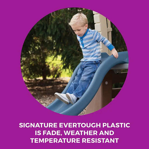 Child sliding on slide from Tot Friendly Outdoor Kids Playset With Two Tier Swing Set, made of fade-resistant Evertough plastic.