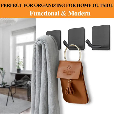 Heavy Duty Adhesive Towel Hooks No Drill Wall Hangers Stick On Shower Hooks For Bathroom Kitchen Door Black 4 Pack Holds Up To 15 Lbs Stainless Steel Rust Resistant Surface Safe Quick Install showing towel and bag hanging