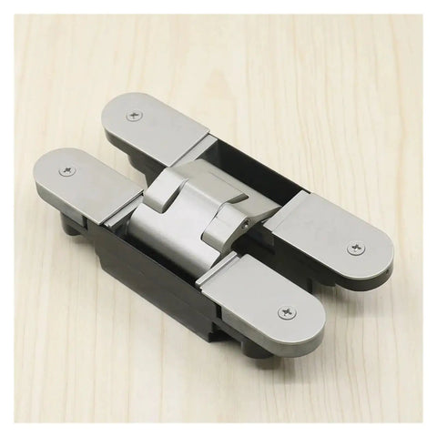 Concealed Secret Door Hinge For Thick Doors Stealthy Hidden Pivot Hardware in sleek metal finish on light wood surface