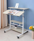 Hella Convenient Height Adjustable Overbed Table And Smooth Rolling Mobile Laptop Desk With Rock Solid Frame Sit To Stand Cart For Sofa Or Bed Side Ergonomic Computer Workstation For Home Office with dual shelves and rolling casters.