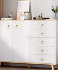 Six Piece Golden Ginkgo Leaf Cabinet Knobs on a sleek white cabinet with wooden accents, perfect for drawers and wardrobes.