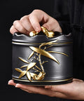 Heavy Duty Ceramic Coffee Canister With Locking Airtight Lid Keep Your Daily Grind Fresh In This Badass Kitchen Tea Caddy held in hand, elegant design.