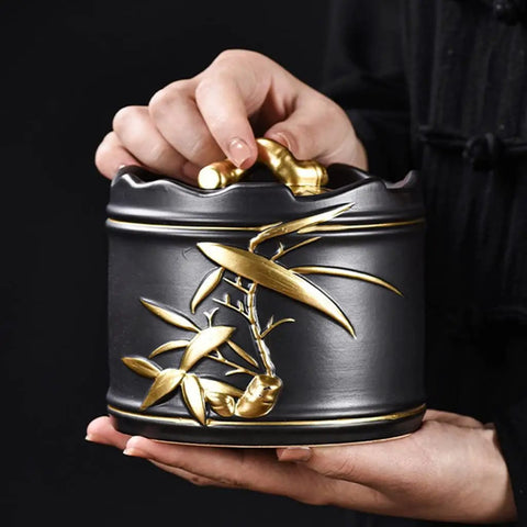 Heavy Duty Ceramic Coffee Canister With Locking Airtight Lid Keep Your Daily Grind Fresh In This Badass Kitchen Tea Caddy held in hand, elegant design.