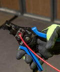 Heavy Duty Automatic Wire Cutter And Stripper For 8 To 20 AWG Solid And 10 To 22 AWG Stranded Wire being used on red wire