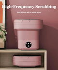 Tiny But Mighty Foldable Mini Washer Skip The Hand Wash Headache Grab And Go Compact Wash Station with built-in drain, pink color.