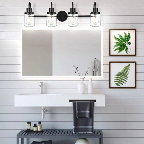 Bathroom with Four Light Black Vanity Light Fixtures With Clear Glass Shades Dope Industrial Wall Sconces above mirror
