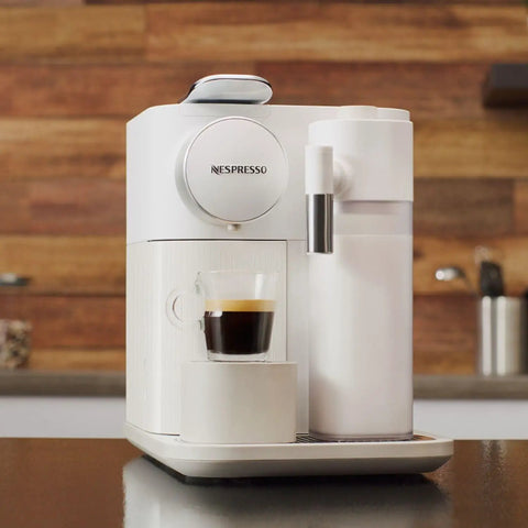 One Touch Automatic Milk Coffee Brewer With Integrated Frother For Barista Level Espresso And Smooth Morning Kick Premium White Finish on countertop with coffee.