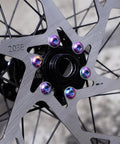 Close-up of a 220mm Bike Disc Brake Rotor Thickened to 2.3mm with colored bolts for road bikes, mountain bikes, MTB, and BMX.