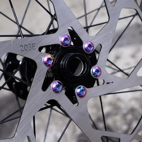 Close-up of a 220mm Bike Disc Brake Rotor Thickened to 2.3mm with colored bolts for road bikes, mountain bikes, MTB, and BMX.