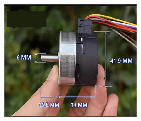 Side view of 24H Runtime Brushless Servo Motor DC 12V With Built In Drive PWM Speed Regulation 100 Line Encoder held by hand
