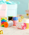 Colorful Prism Mini Kaleidoscopes For Kids 48 Pack with Six Designs Blue Party Favors and Classroom Prizes on a table.