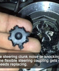 Flexible Steering Coupling MDPS Steering Column Repair Kit for Hyundai and Kia, damaged coupling in hand.