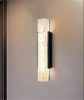 Modern Linear Wall Sconce Imitated Marble LED Wall Light,Warmth mounted on wall, showcasing elegant marble design and black accents.