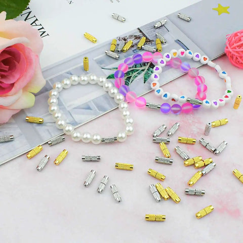 50 Pcs Brass Screw Twist Clasps For Jewelry Making Kit with white pearl and colorful beaded bracelets on a pink surface.