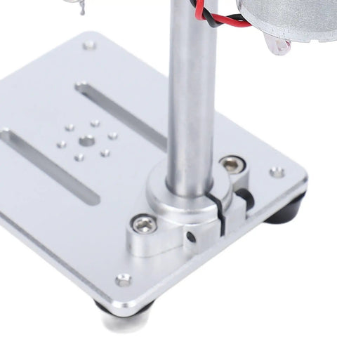 Keenso Mini Benchtop Drill Press Variable Speed Adjustable Rotating Tool For Drilling Wood Metal Jewelry With Us Plug 100-240V precision motor base close-up showing sturdy aluminum construction.