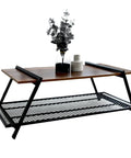 Rectangular Farmhouse Coffee Table With Handy Storage Shelf And Real Steady Iron Frame Rustic Brown Finished, featuring plants and decor.