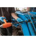 Heavy-Duty Grease Fitting Cleaner For Hardened Clogs With Impact Tool being used on blue machinery