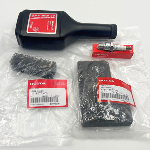 Honda Generator Maintenance Tune Up Kit With Genuine Air Filter 17211Z07000 And 17218Z07000 Spark Plug 98056 55777 And 10W30 Motor Oil For EU2000i EB2000i EU2200i EB2200i Generators displayed in packaging.