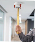 Smoke Sensor Removal Tool With Claw Head Attachment For Ceilings in use, showcasing aluminum alloy frame and grip, safely pulling a smoke detector.