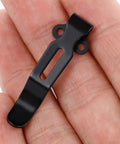 Top Shelf Titanium Replacement Screws And Pivot Shaft Kit For Benchmade Bugout 535 533 537 Folding Knives showing a black clip held by hand.