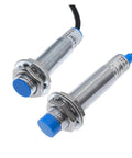 Inductive Proximity Switch Sensor LJ12A3-4 PNP/NPN 4mm Sensing Distance Built Tough Plastic Metal Housing With Smooth Onoff Control For Stable Circuit Switching, Ideal For Industrial Automation, Robotic Arms, And Conveyors. two threaded metal sensors with blue tips